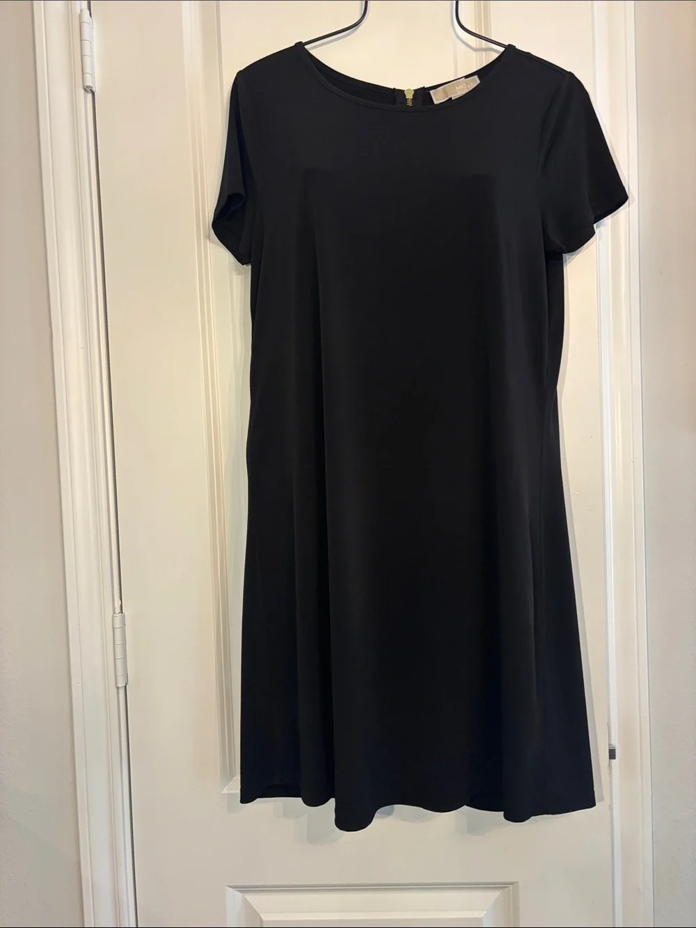 Michael Kors classic black short sleeve A-line with gold zipper mini dress. S